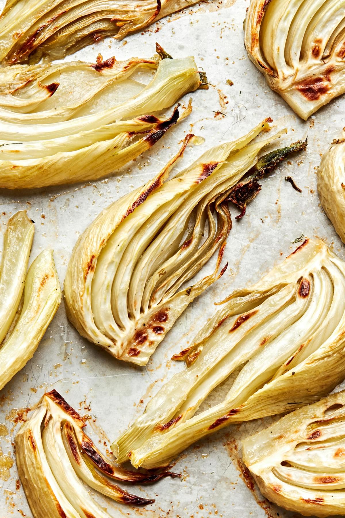 roasted fennel on a baking sheet made with olive oil, salt, garlic powder and pepper