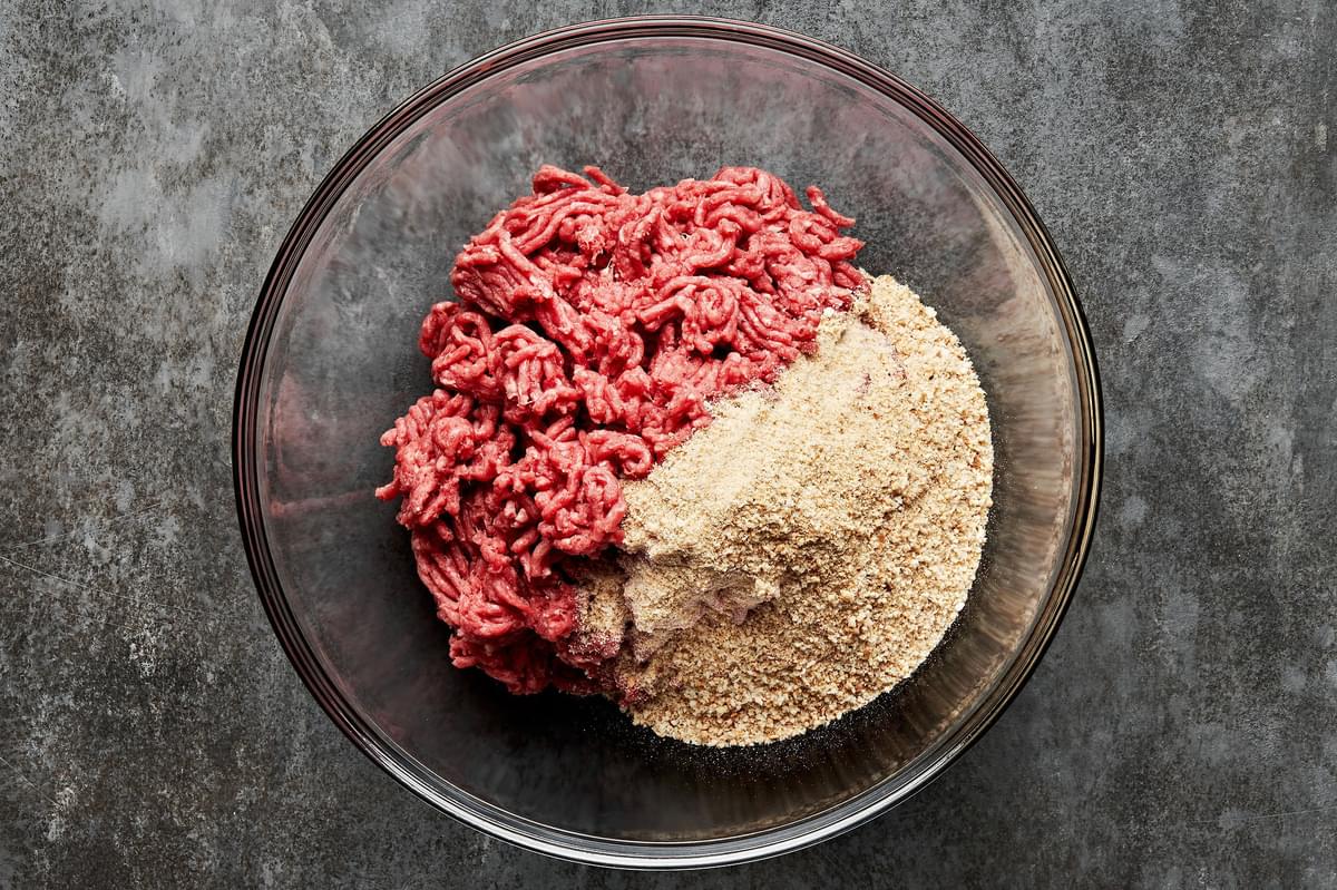 ground beef and breadcrumbs  in a mixing bowl for making salisbury steak patties