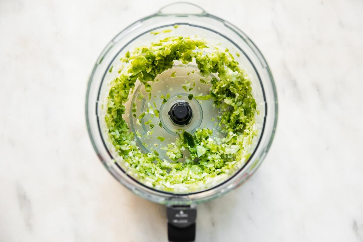 jalapeno, onion and green bell peppers chopped up in a food processor