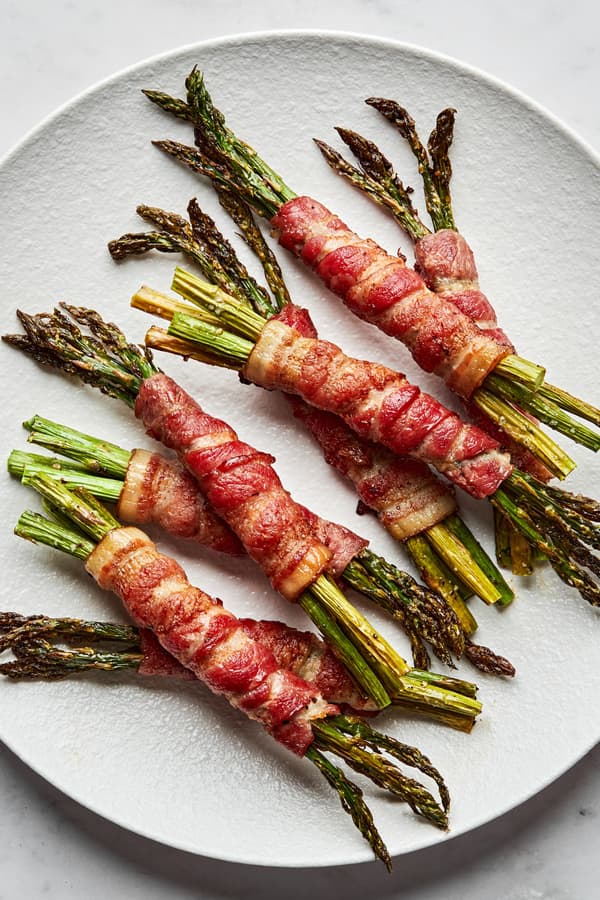 bacon wrapped asparagus on a plate