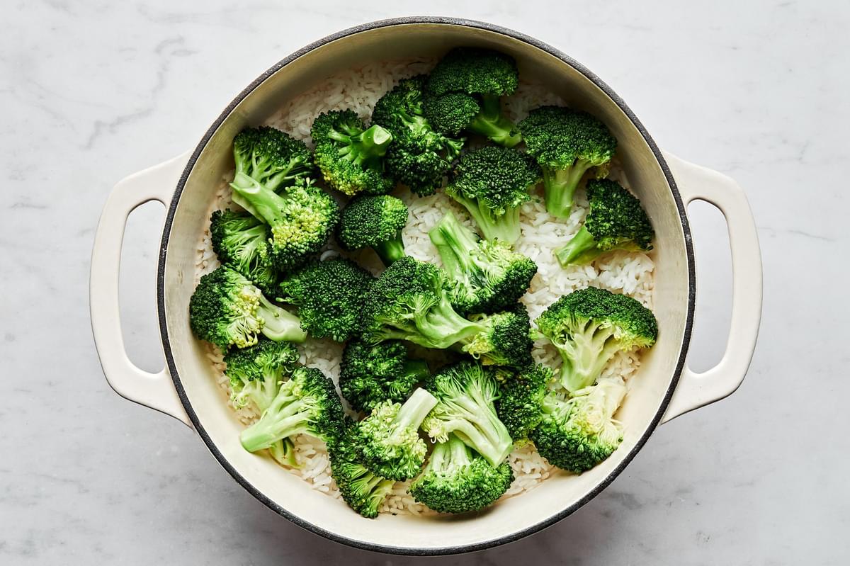 cooked rice and broccoli in a pot