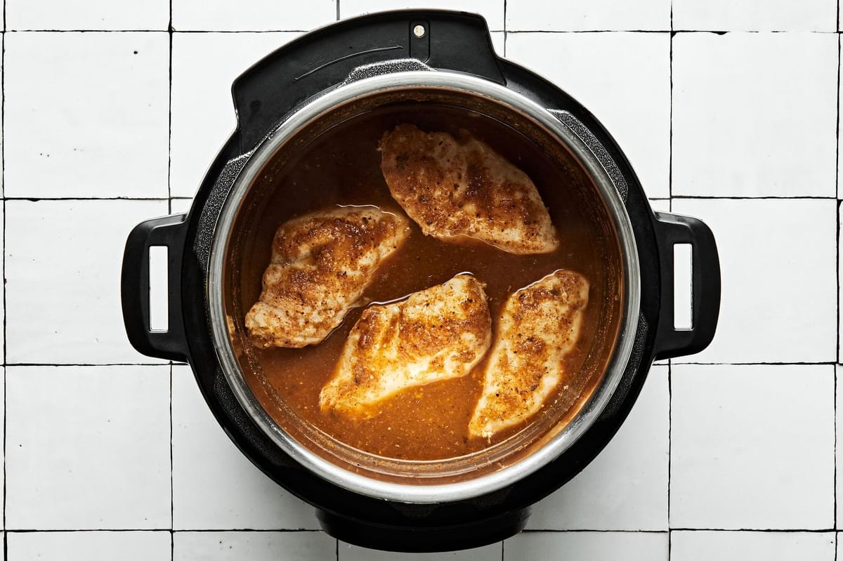 chicken cooked in taco seasoning and salsa in an Instant pot