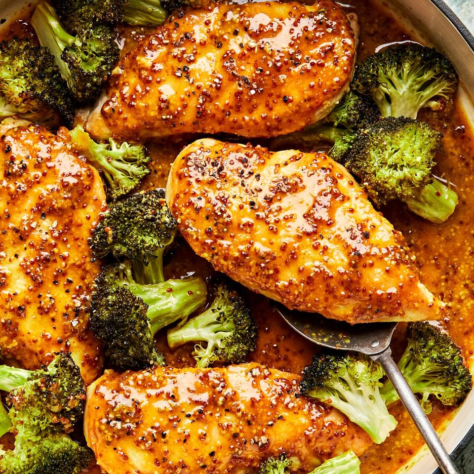 honey mustard curry chicken with broccoli in a skillet
