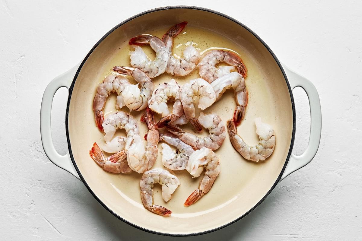 shrimp being cooked in a skillet