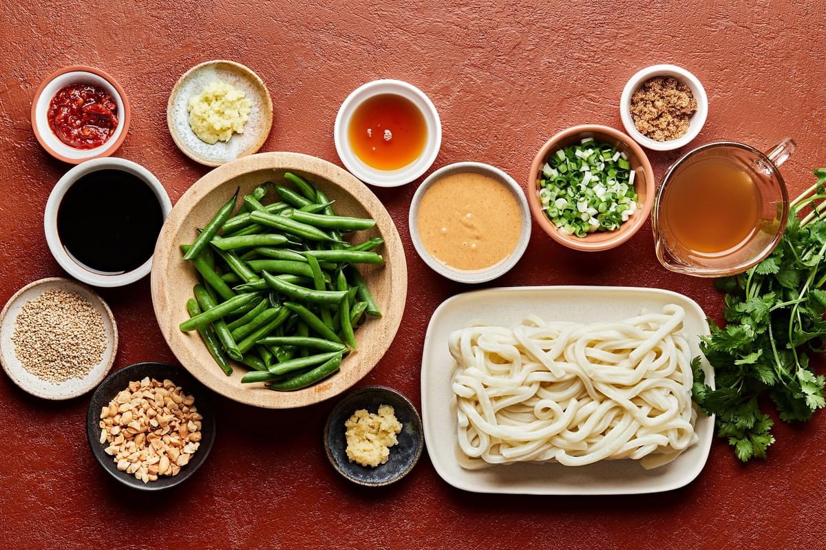 udon noodles, green beans, sesame oil, tamari, sambal oelek, brown sugar, peanut butter and stock in prep bowls