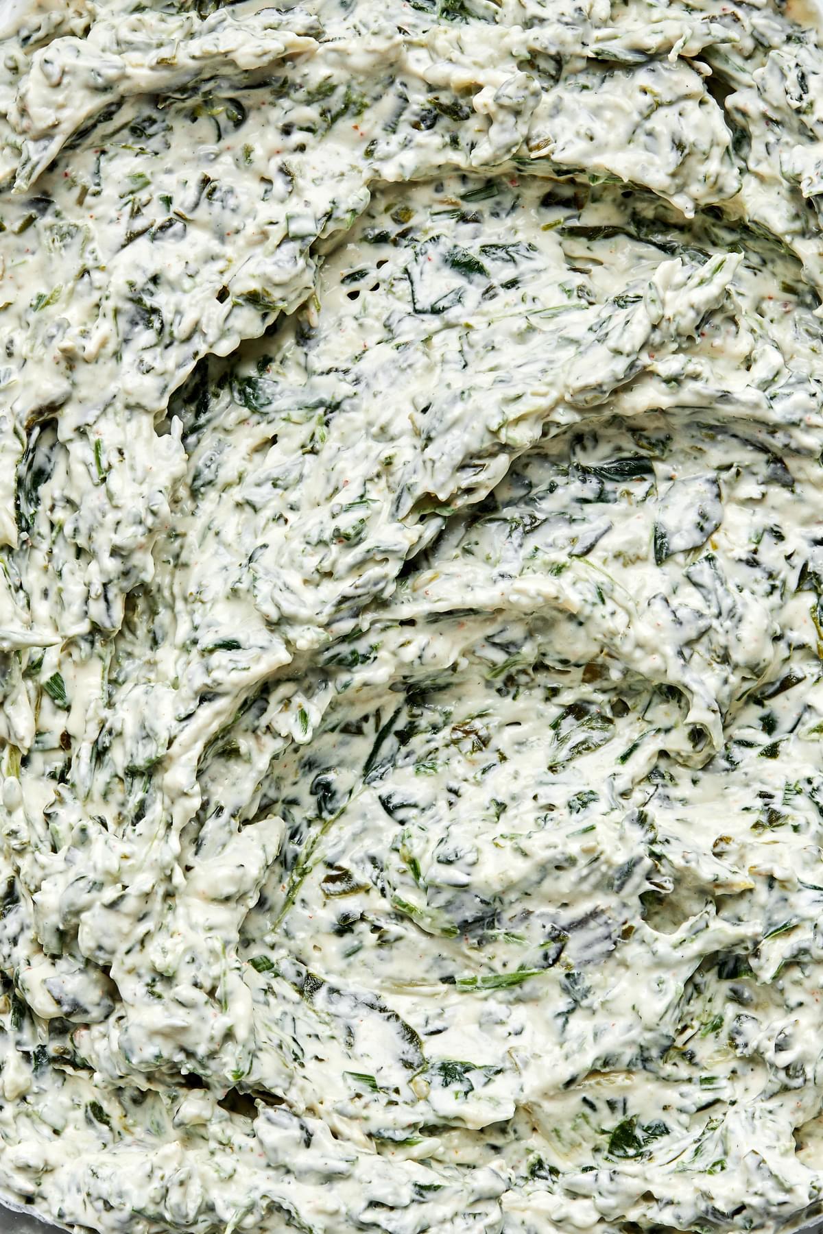 homemade spinach dip made with sour cream, mayonnaise, spinach, spices, worcestershire, dijon and chives