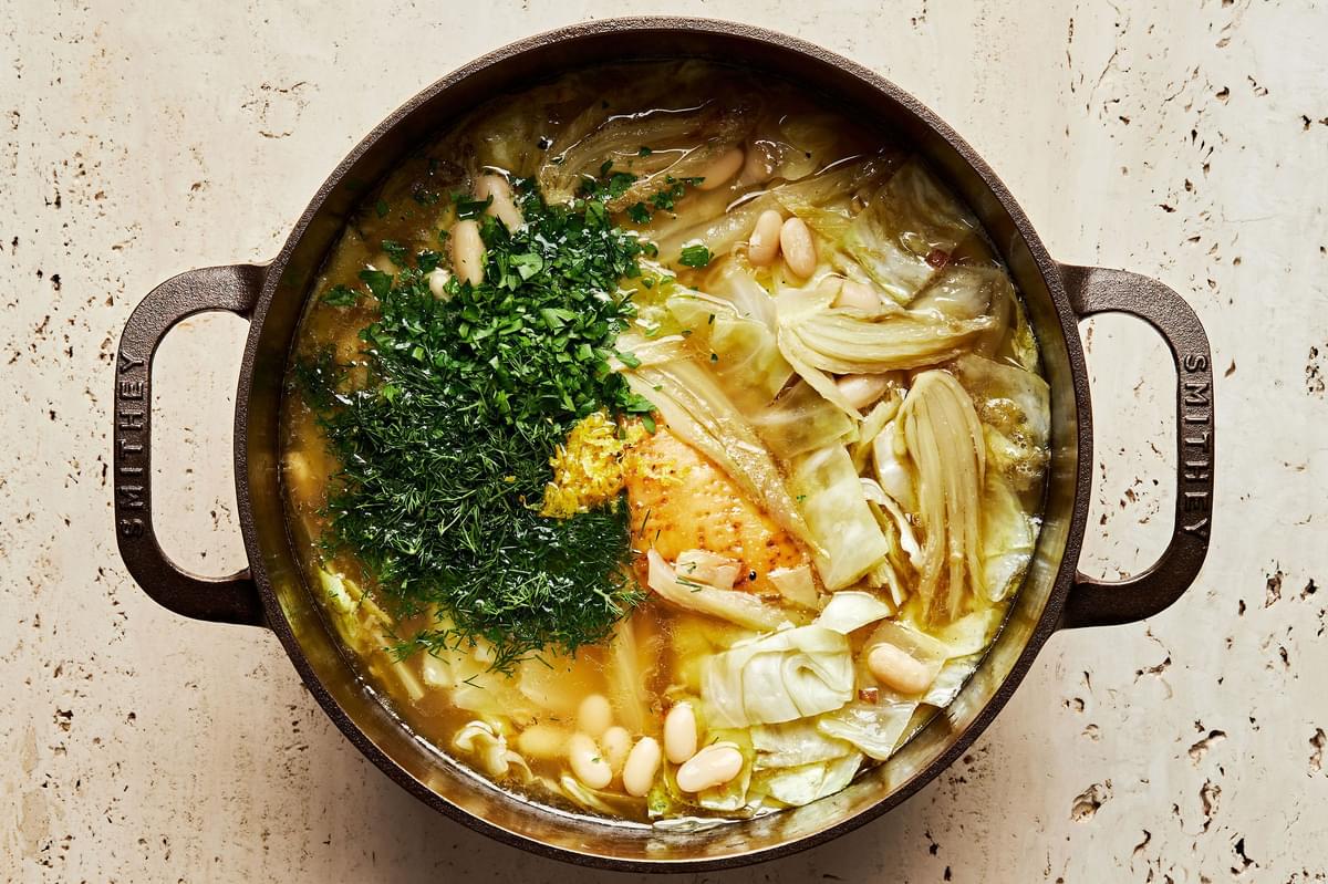 White Bean Soup with Dill and Cabbage being cooked in a large soup pot