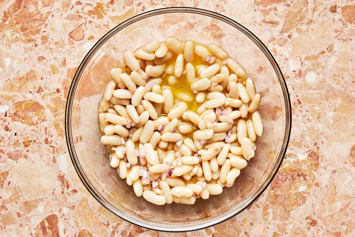 drained canned white beans tossed in a vinaigrette made of olive oil, lemon juice, mustard, sugar, shallots and salt