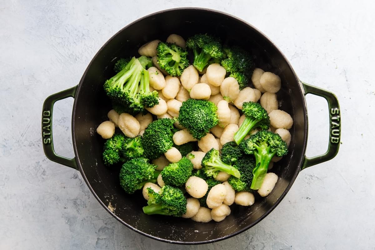 blanched gnocchi and broccoli in a Dutch oven