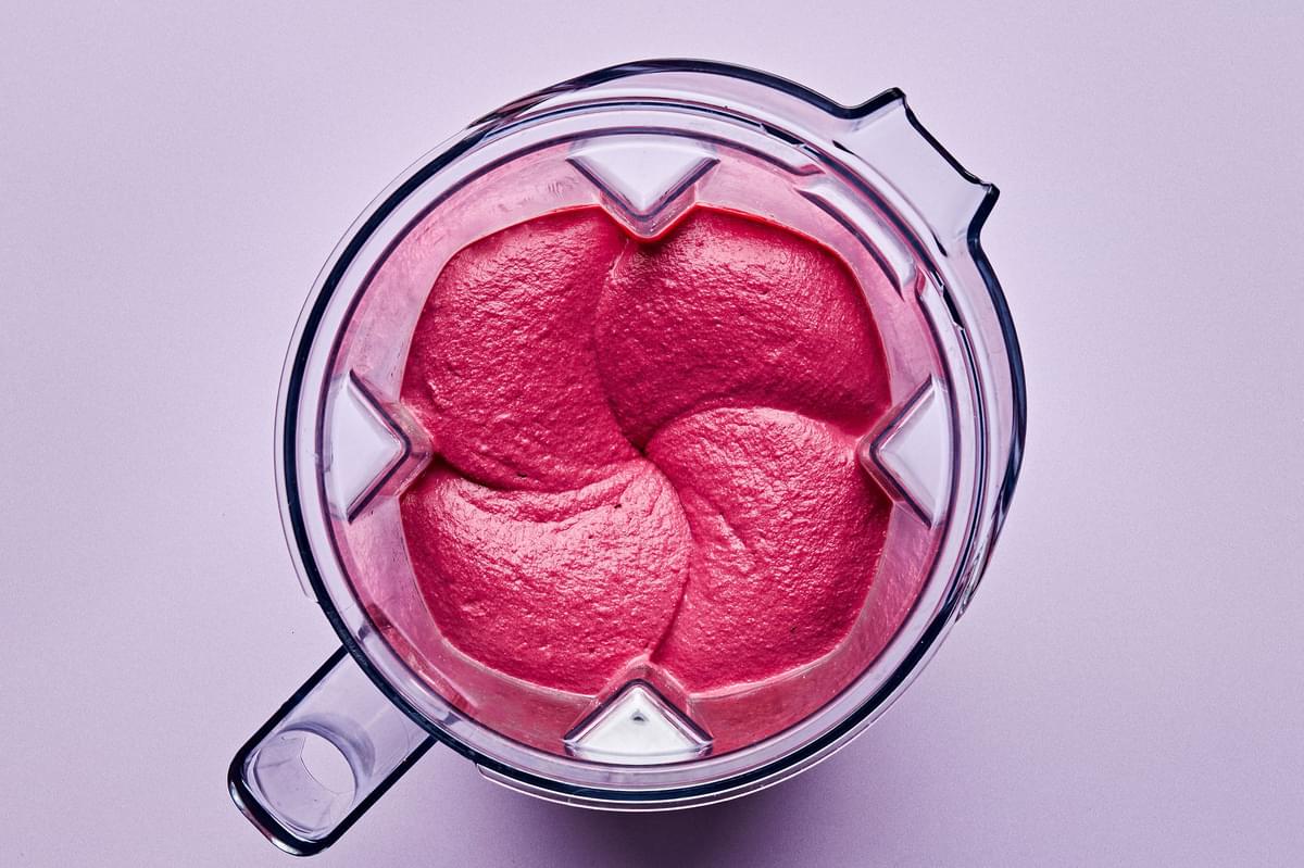 smooth and creamy homemade beet hummus in a high speed blender