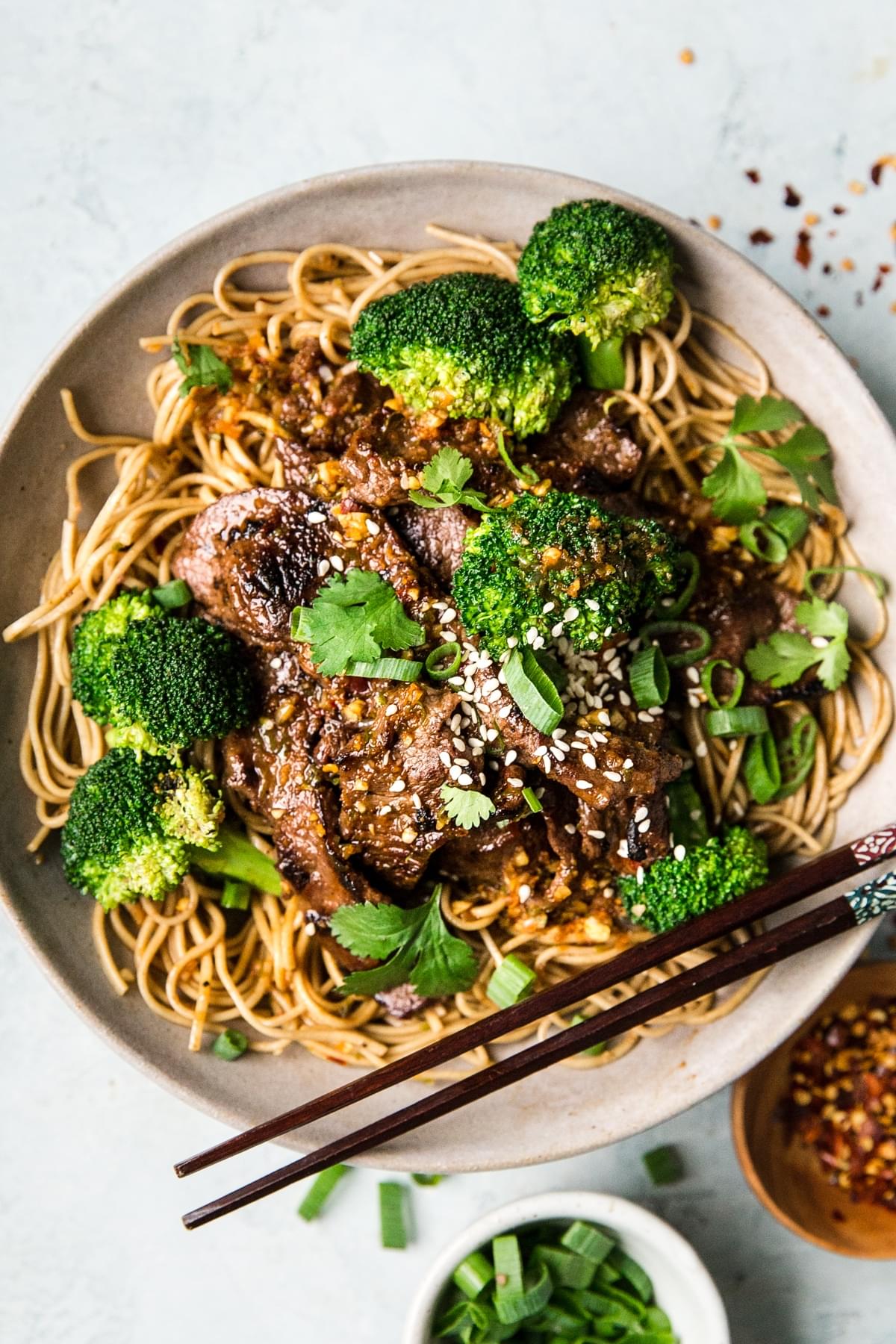 broccoli Beef Soba Bowl with buckwheat noodles with chop sticks