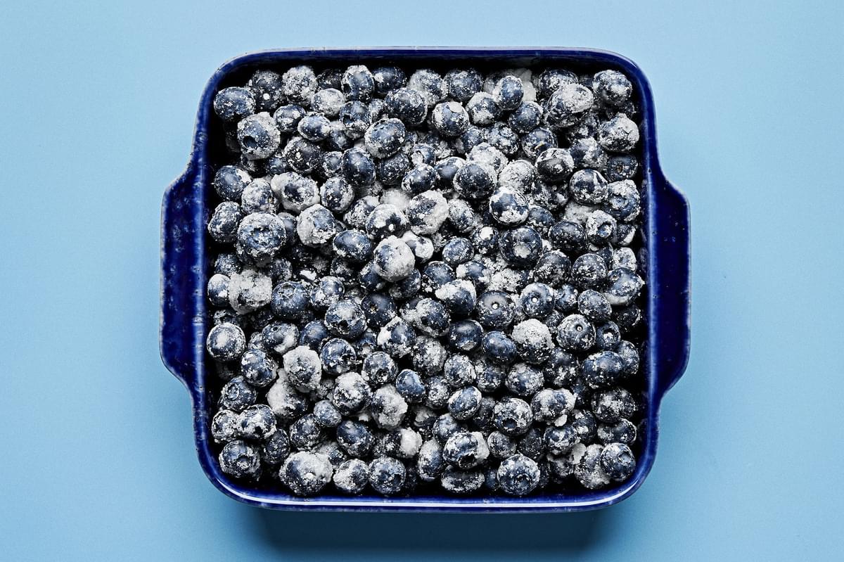 blueberries tossed with salt, cornstarch, sugar, and lemon juice in a baking dish