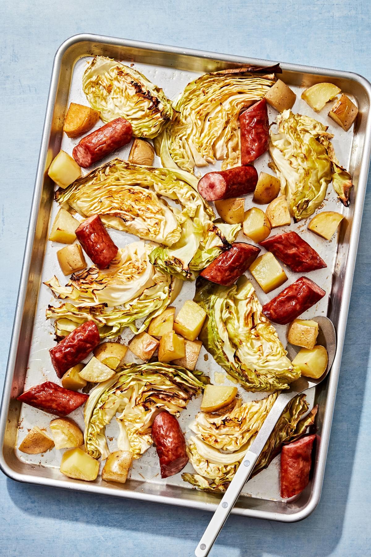 cabbage, sausage and potatoes roasted on a sheet pan