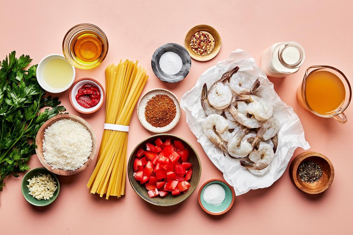 pasta, shrimp, olive oil, lemon juice, spices, sugar, tomatoes, tomato paste, cream & parmesan in prep bowls