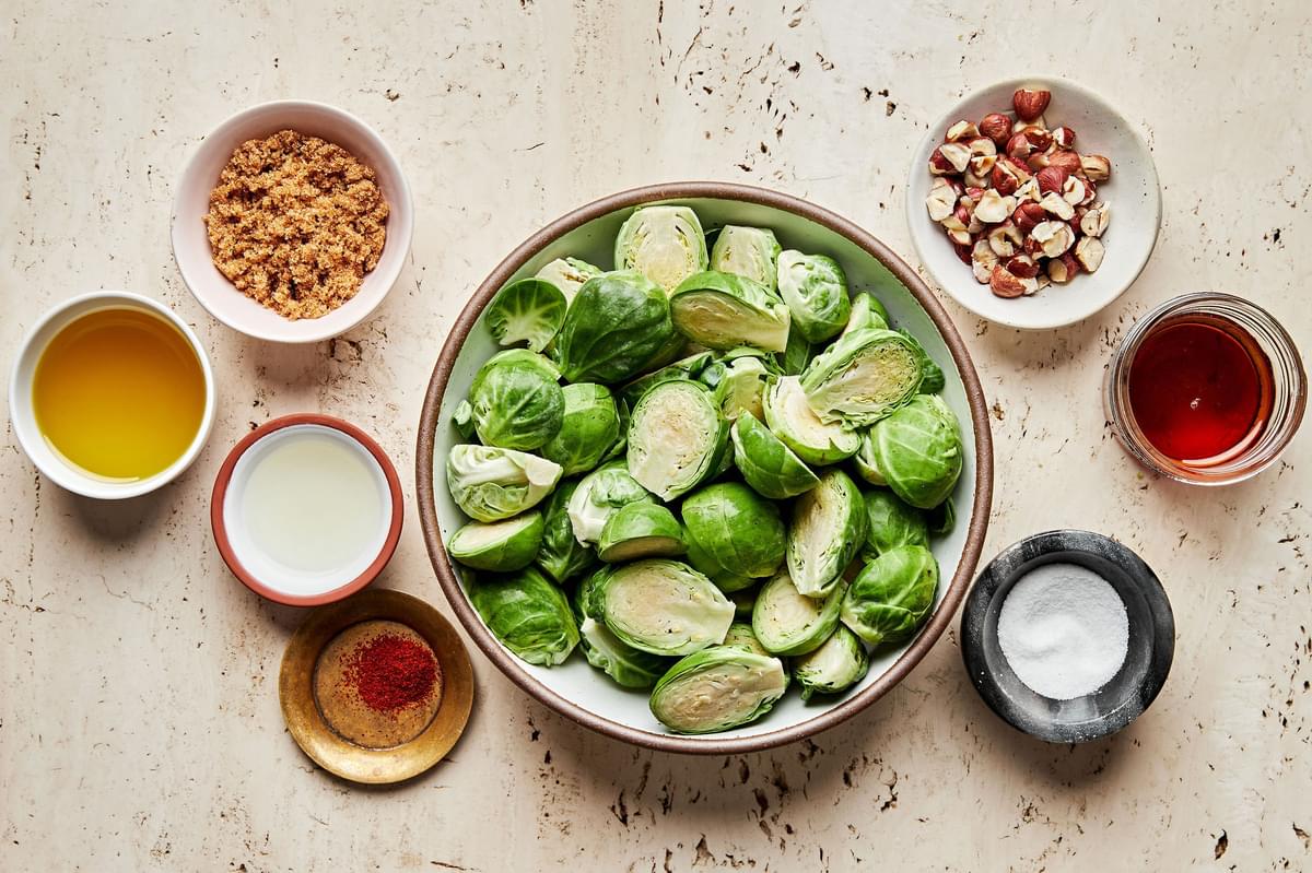 brussels sprouts, maple syrup, brown sugar, olive oil, lemon juice, salt, cayenne and hazelnuts in prep bowls