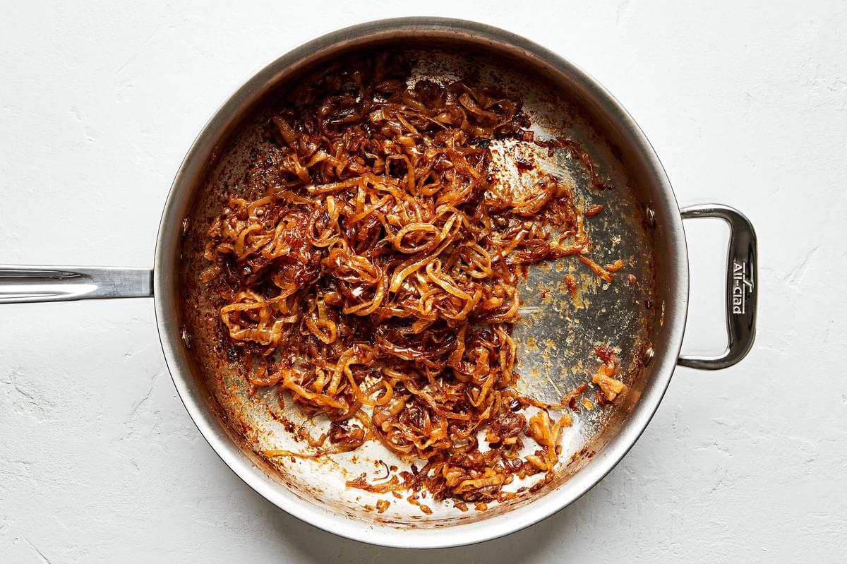 caramelized onions in a skillet made with olive oil, butter and brown sugar