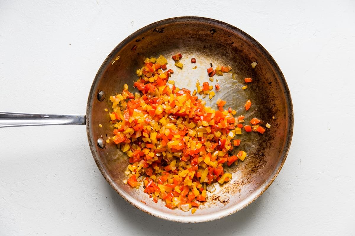 minced Onion, Bell peppers and garlic in olive oil in a skillet