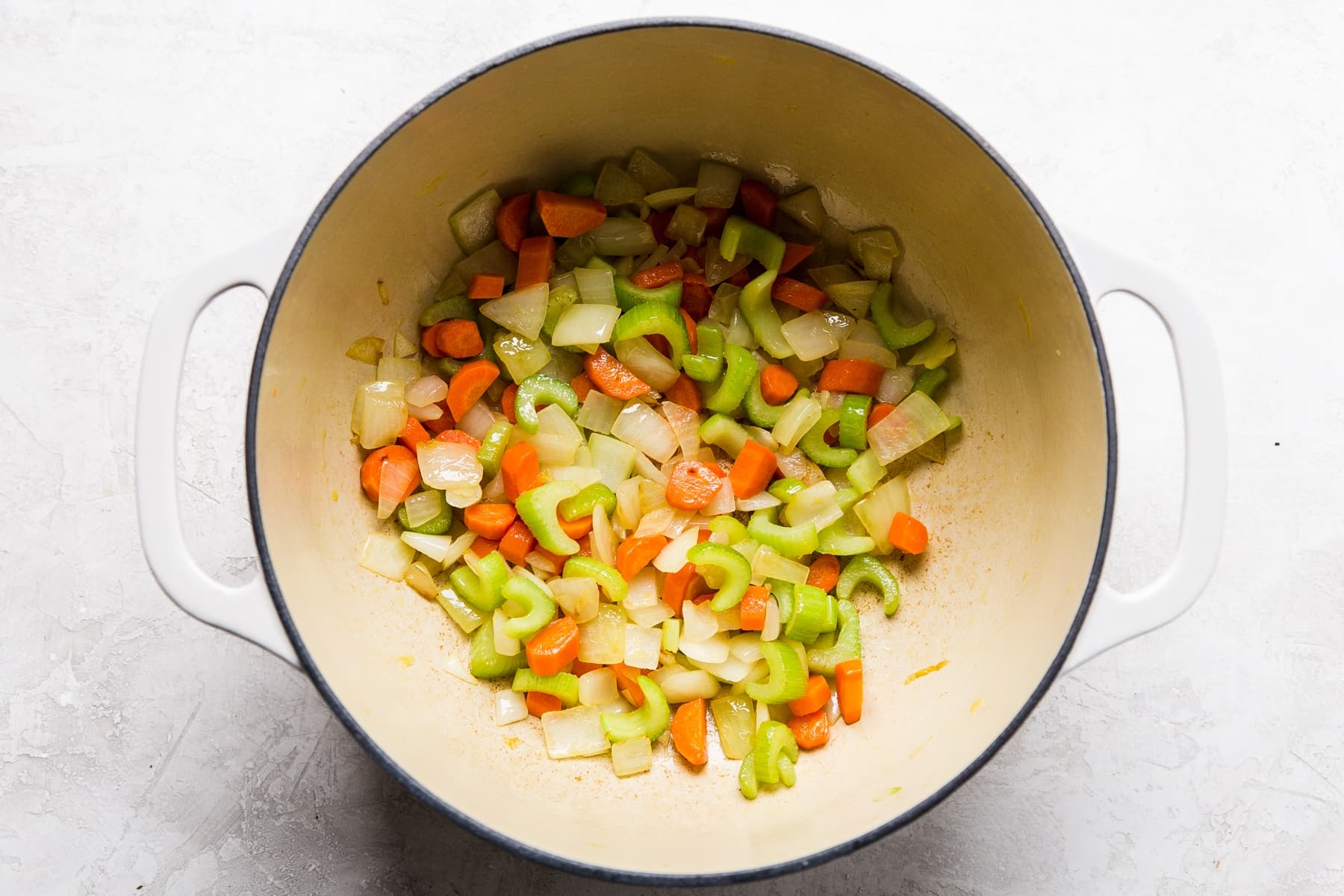 carrots, celery, onions in a soup pot