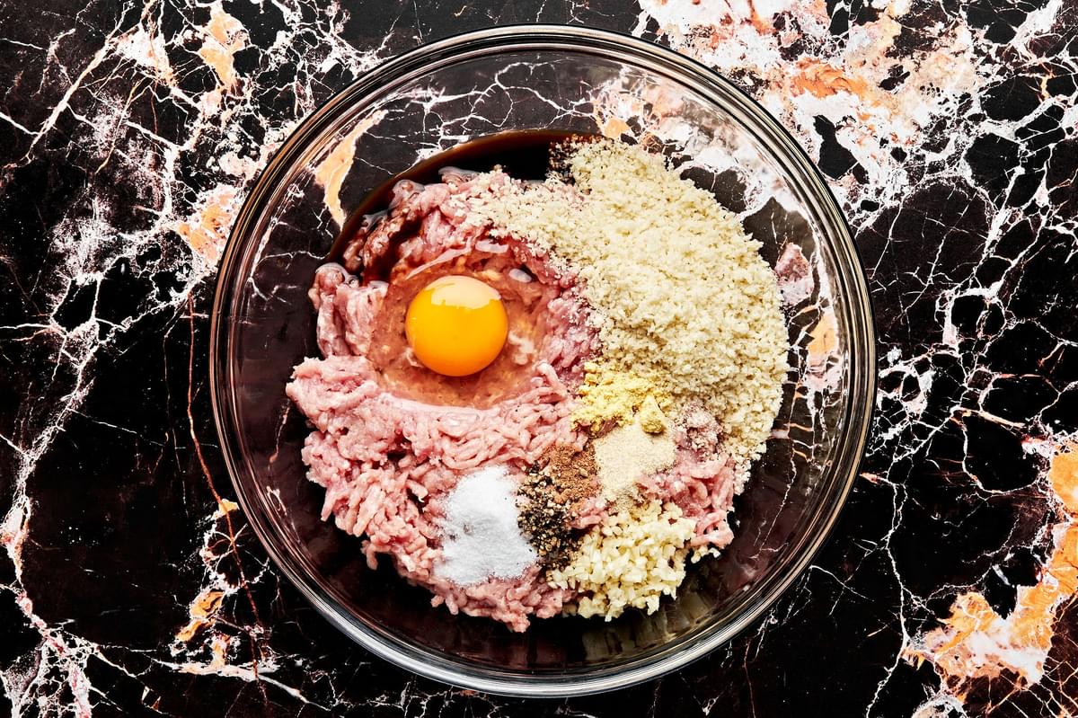 ground turkey, breadcrumbs, spices, Worcestershire, and an egg in a glass bowl to make turkey meatballs
