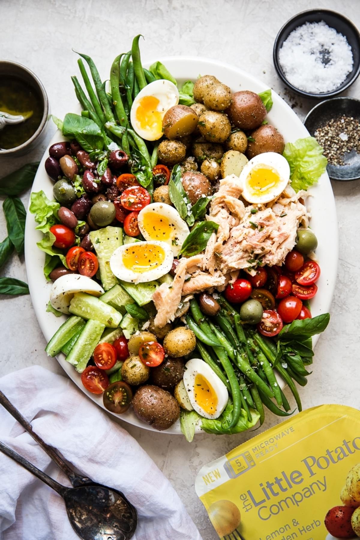 Classic Salad Niçoise with potatoes, cucumber, olives, green beans and smoked trout.
