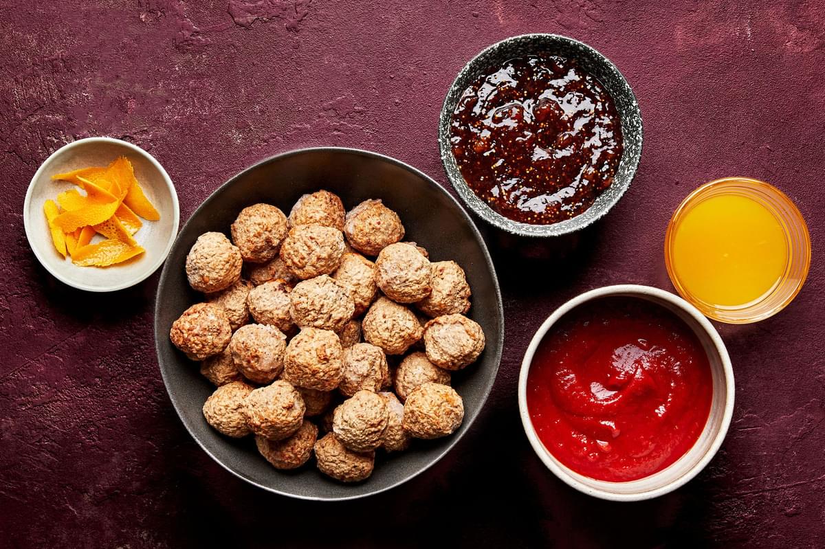 frozen meatballs, fig jam, chili sauce, orange juice and orange zest in prep bowls to make fig jam meatballs