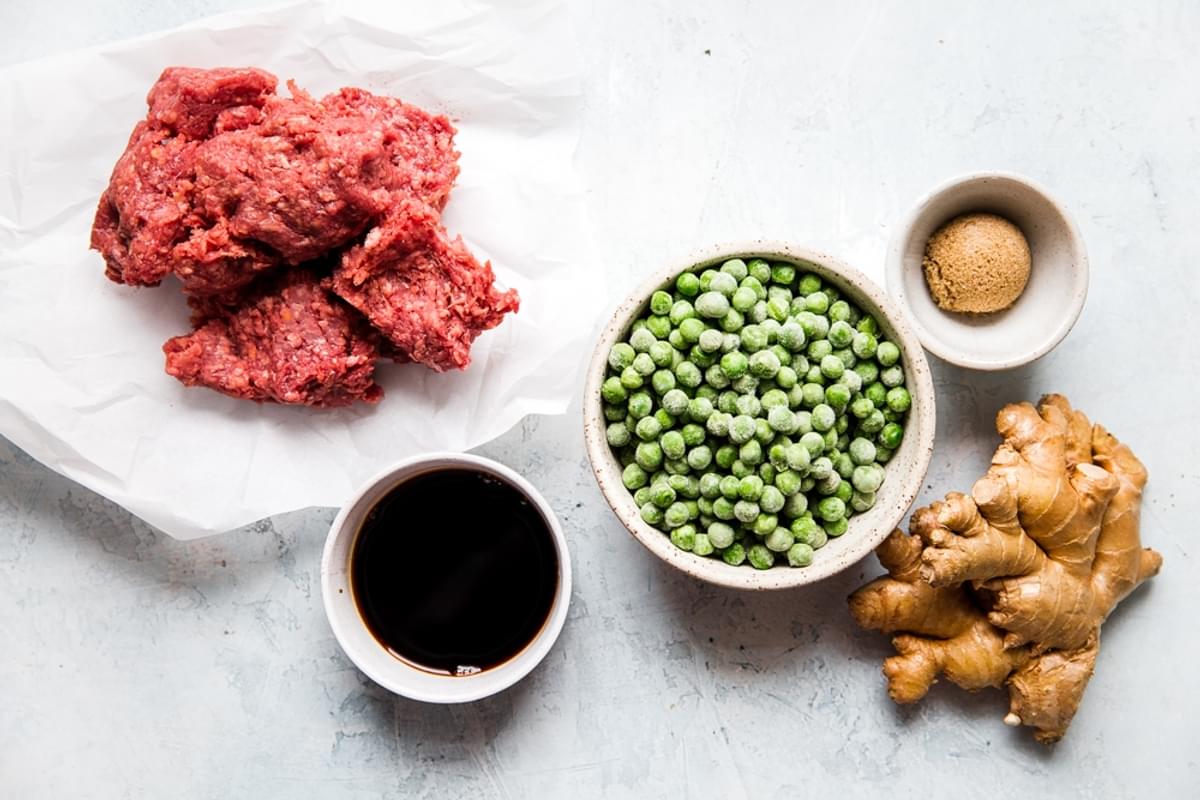 ingredients laid out for soboro donburi ground beef, peas, ginger, brown sugar and soy sauce