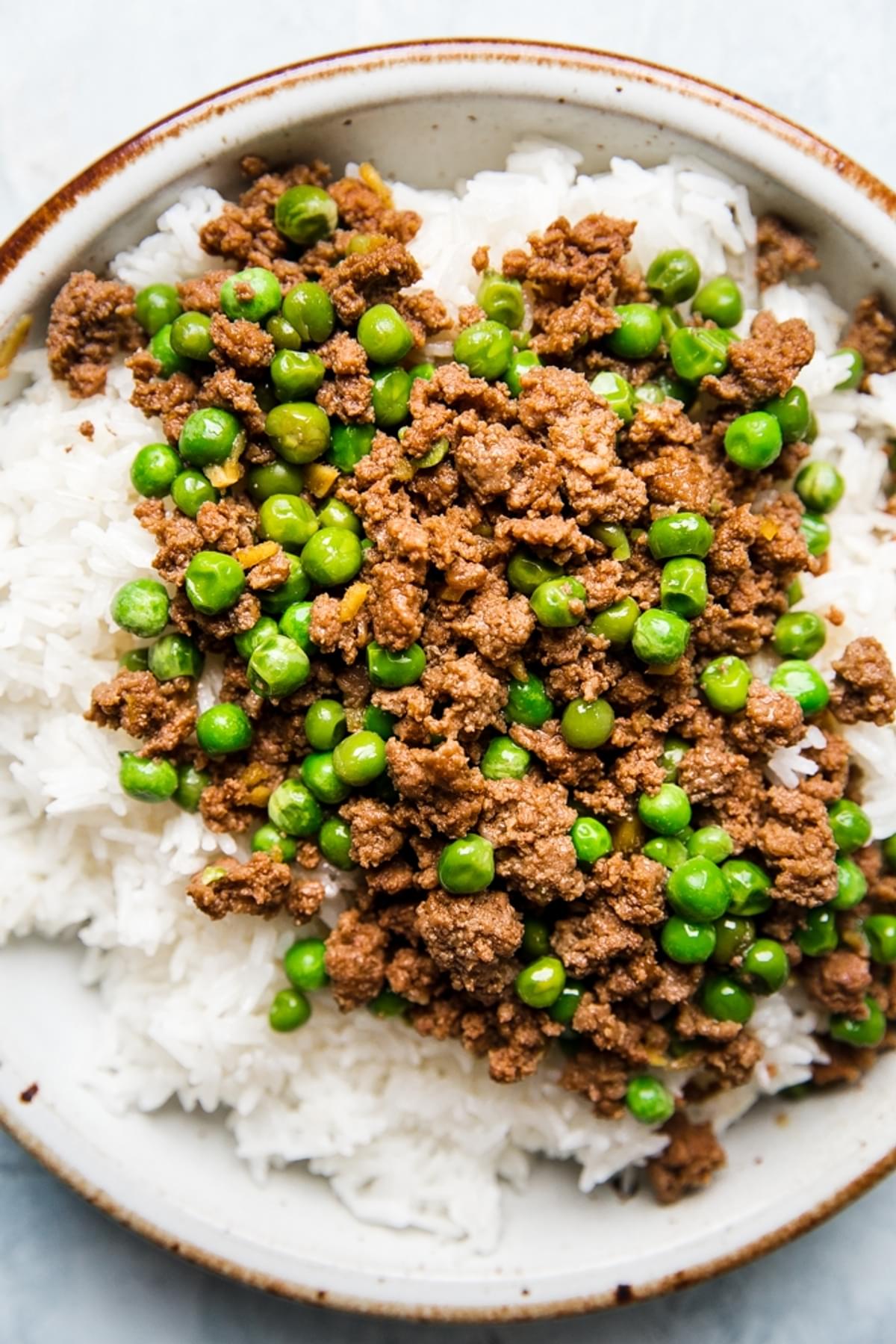 sober donburi beef with peas and ginger on a plate