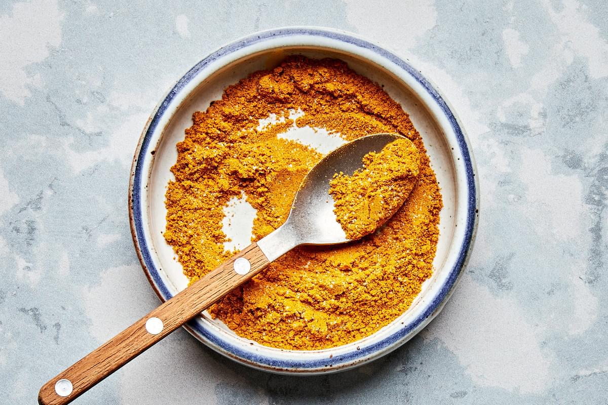 curry powder, turmeric, salt and cayenne mixed together in a bowl