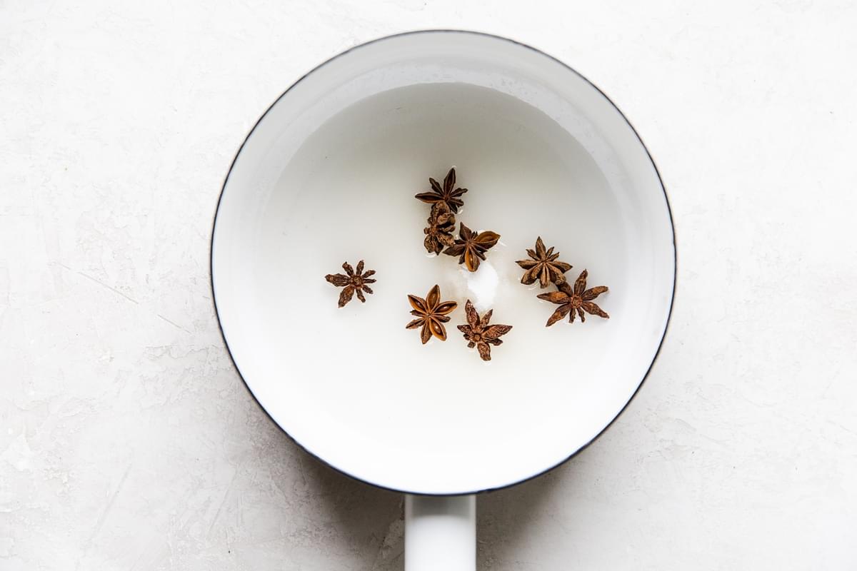 star anise simple syrup in a small pot