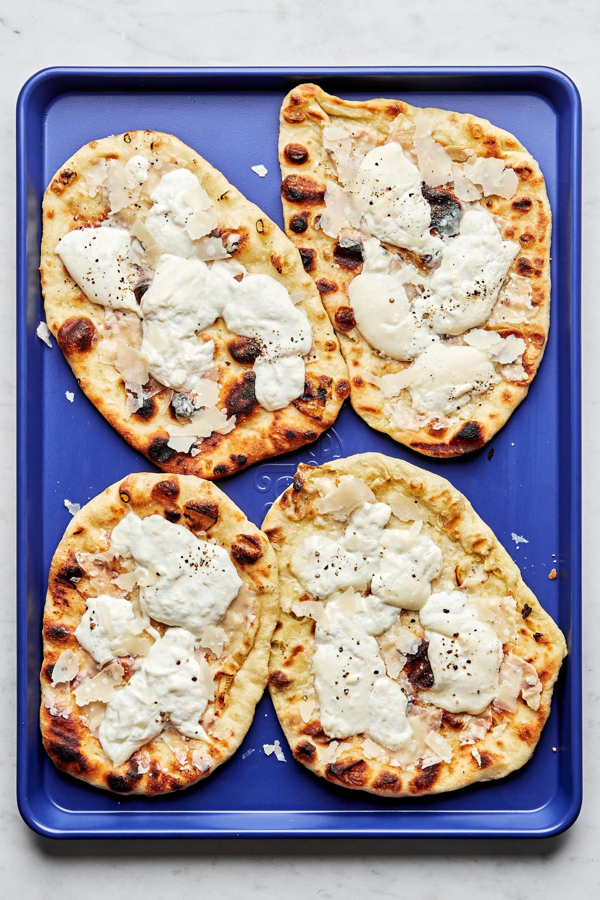 grilled flatbread with burrata cheese on a serving platter