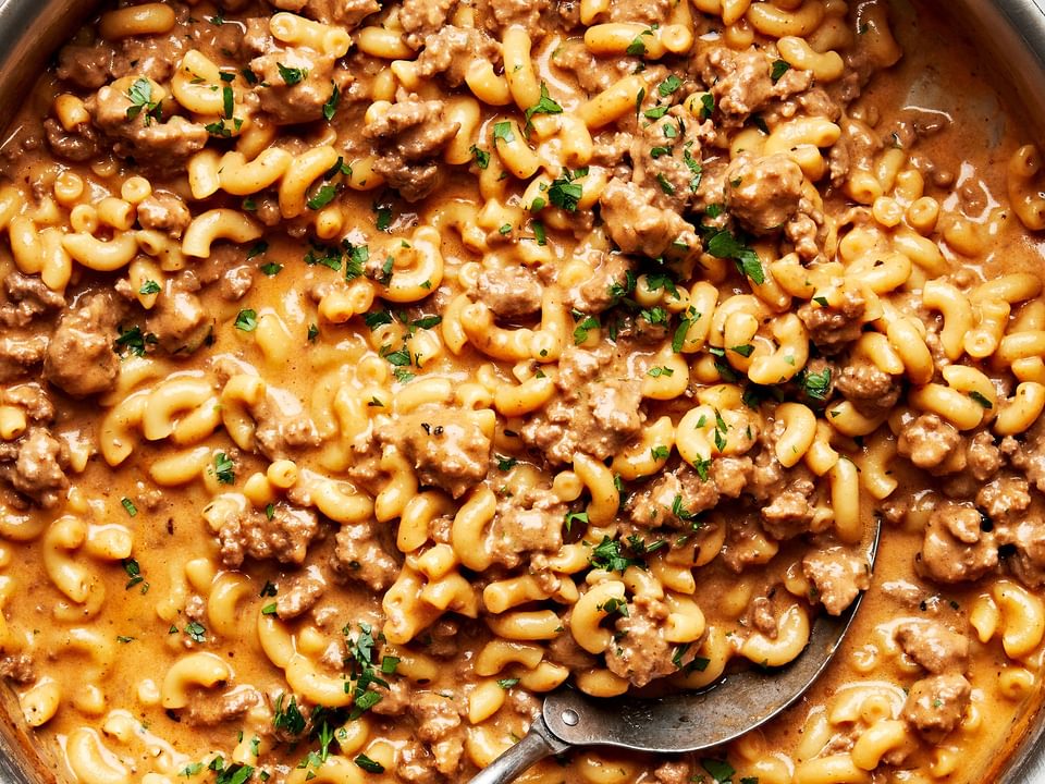 a pan of homemade hamburger helper made with pasta, ground beef, milk, butter, beef stock, cheese and spices