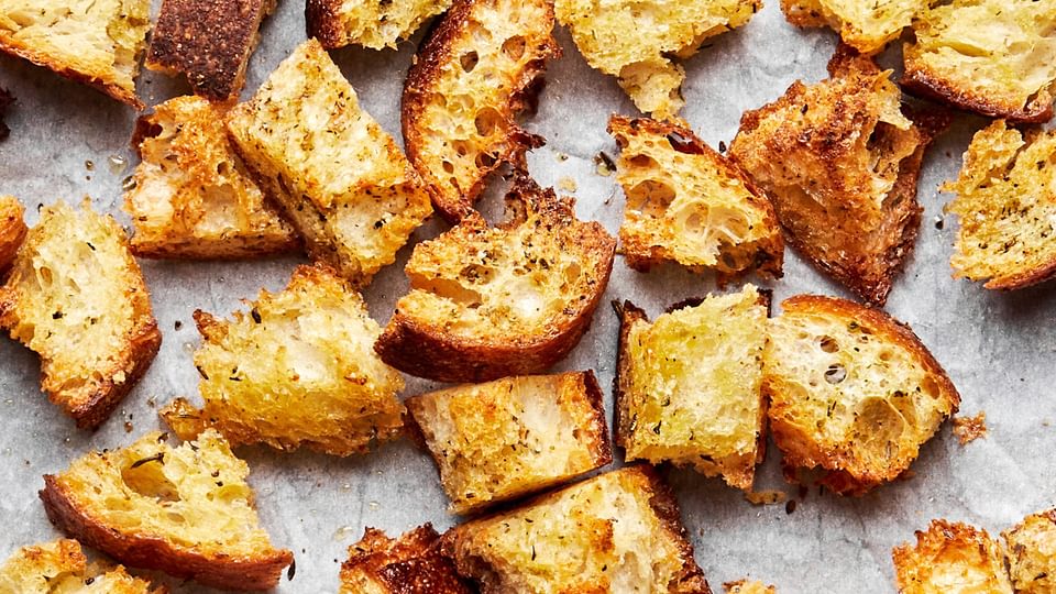 homemade croutons made with rustic bread tossed in olive oil, Italian seasoning, garlic powder & salt then baked in the oven