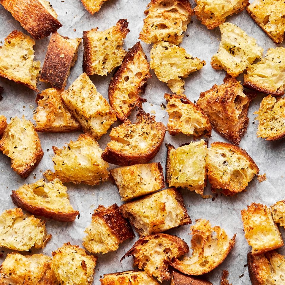 homemade croutons made with rustic bread tossed in olive oil, Italian seasoning, garlic powder & salt then baked in the oven
