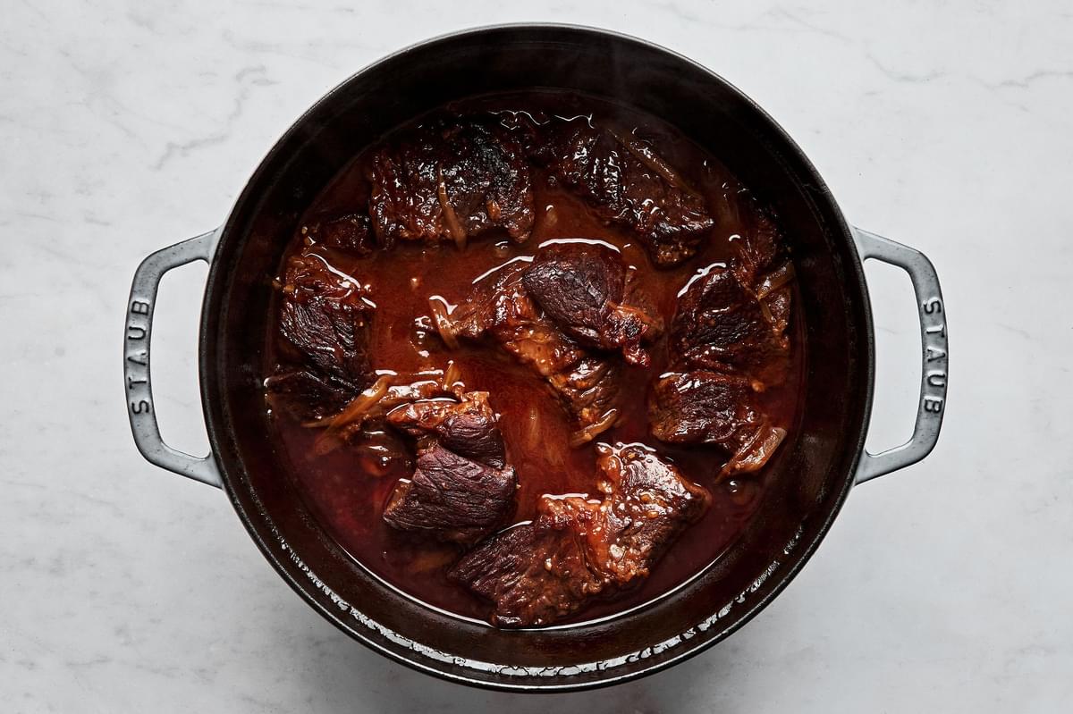 chuck roast cooked in a pot with onions, garlic, ginger, beef stock, gochujang paste, brown sugar & soy sauce