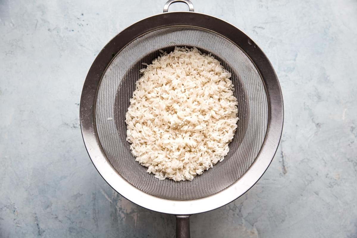 rinsed long grain white rice in a fine mesh sieve