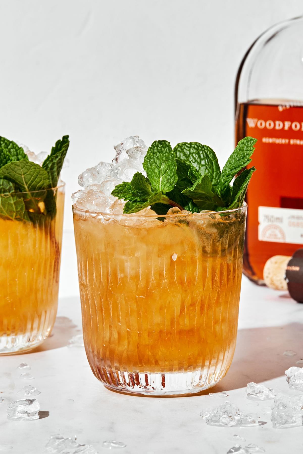 homemade mint julep in a glass made with fresh mint, bourbon and simple syrup served over crushed ice with fresh mint leaves