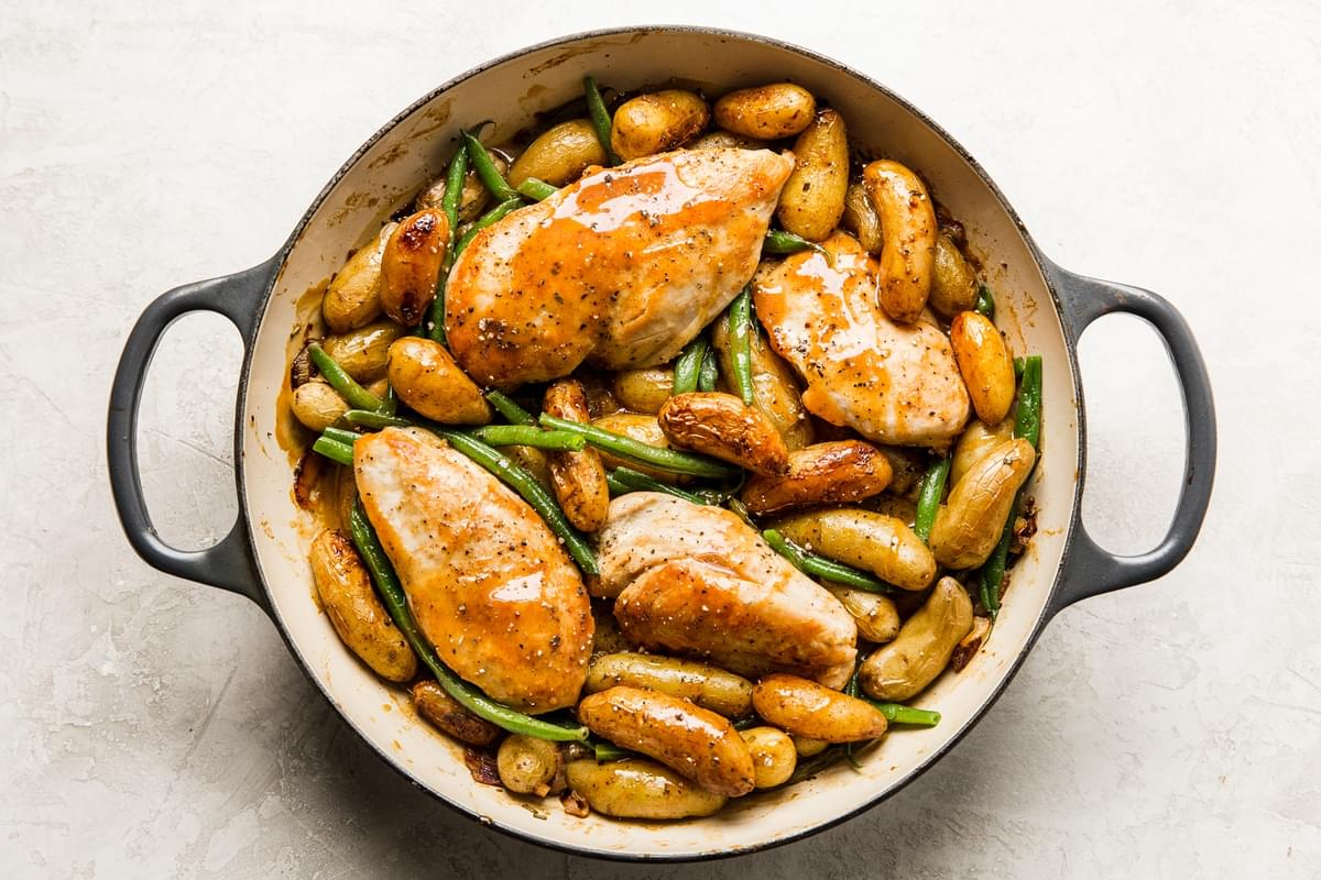 chicken, green beans, potatoes, and shallots tossed with honey mustard sauce in a brasier