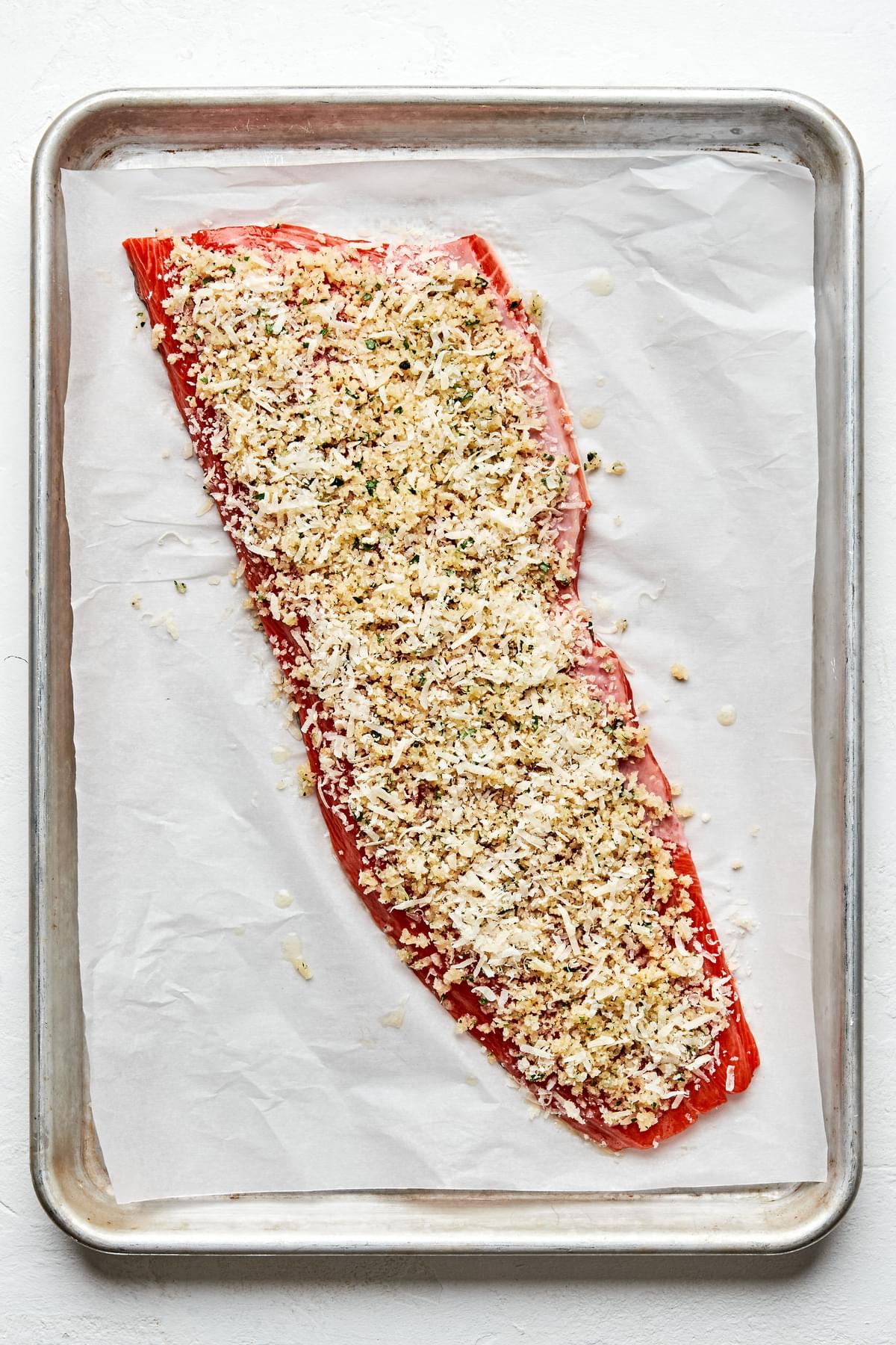 salmon brushed with melted butter, coated with panko, garlic powder, parsley, salt, pepper & parmesan on a baking sheet