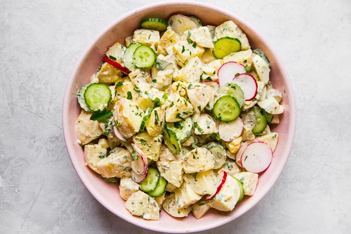 classic potato salad in a pink 
bowl