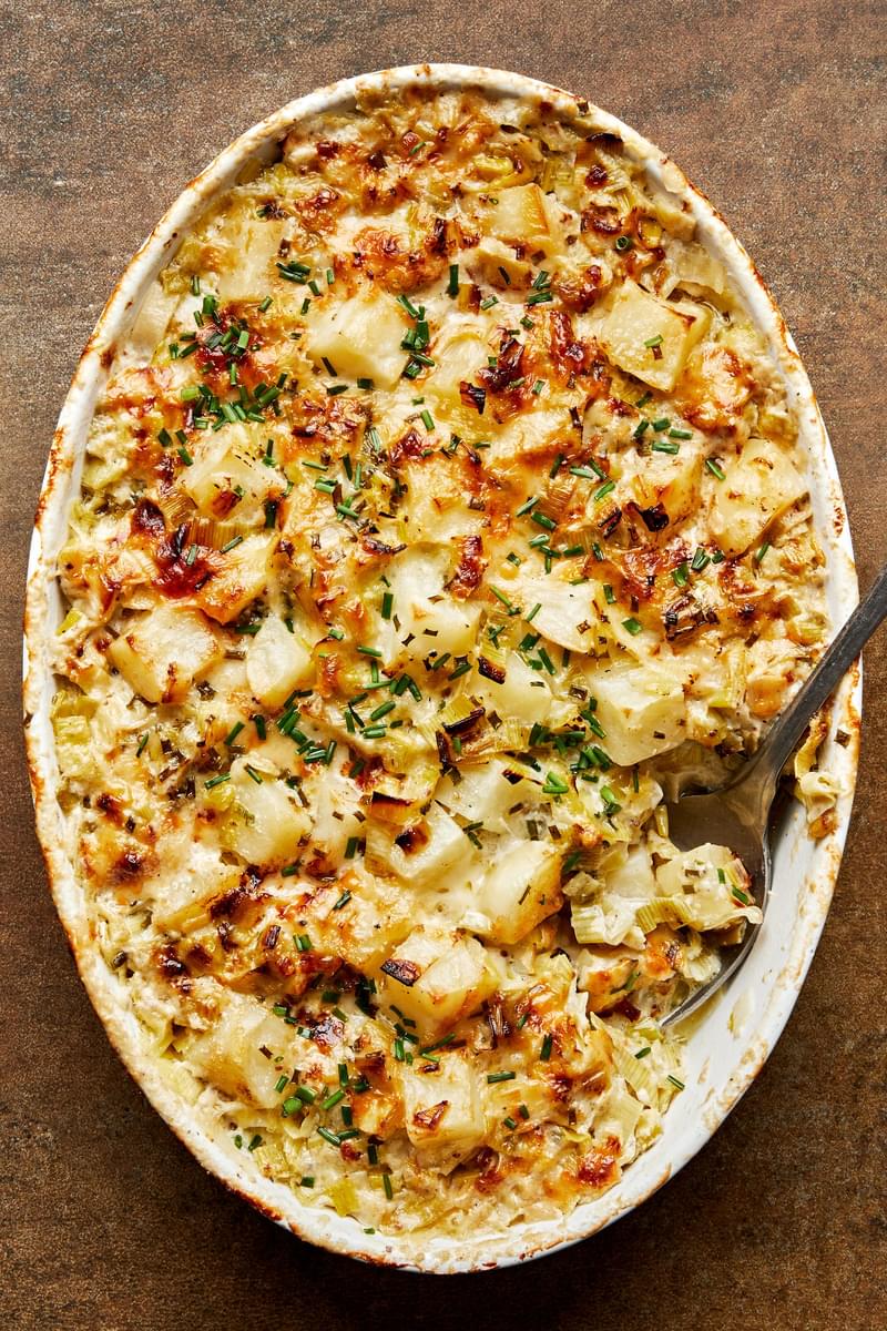 potato leek au gratin made with gruyère, parmesan, blue cheese, butter, cream, spices and ground mustard topped with chives