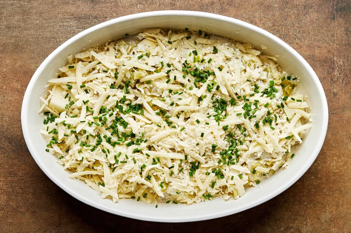 potatoes, leek cream sauce, cheese and chives layered in a baking dish