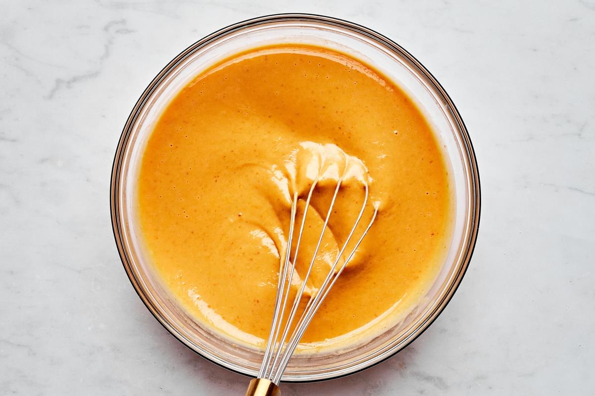 pumpkin, condensed milk, eggs, egg yolk, vanilla and spices whisked together in a  glass mixing bowl
