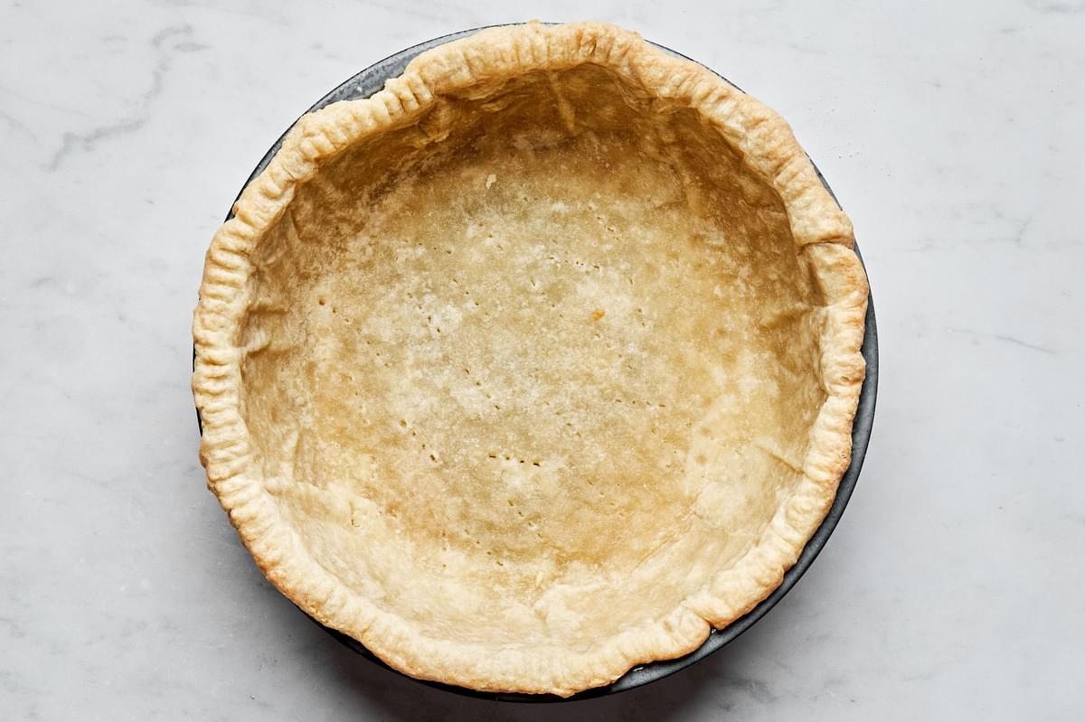 a par-baked pie crust in a pie plate