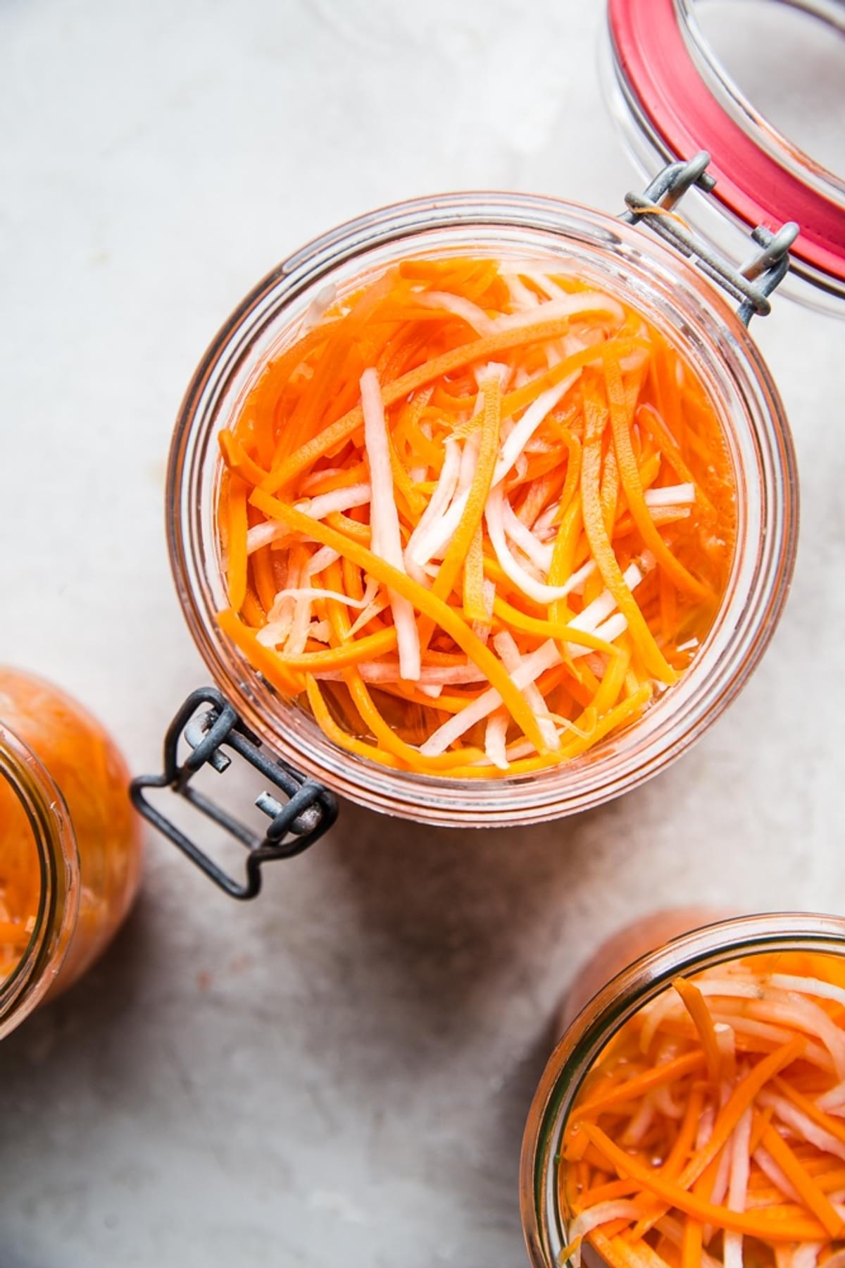 a jar of pickled carrots and daikons