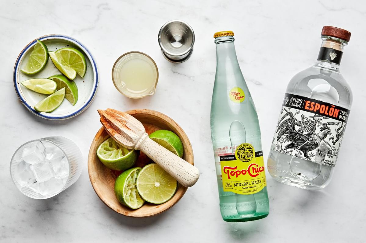 limes, sparkling mineral water, tequila and ice to make ranch water