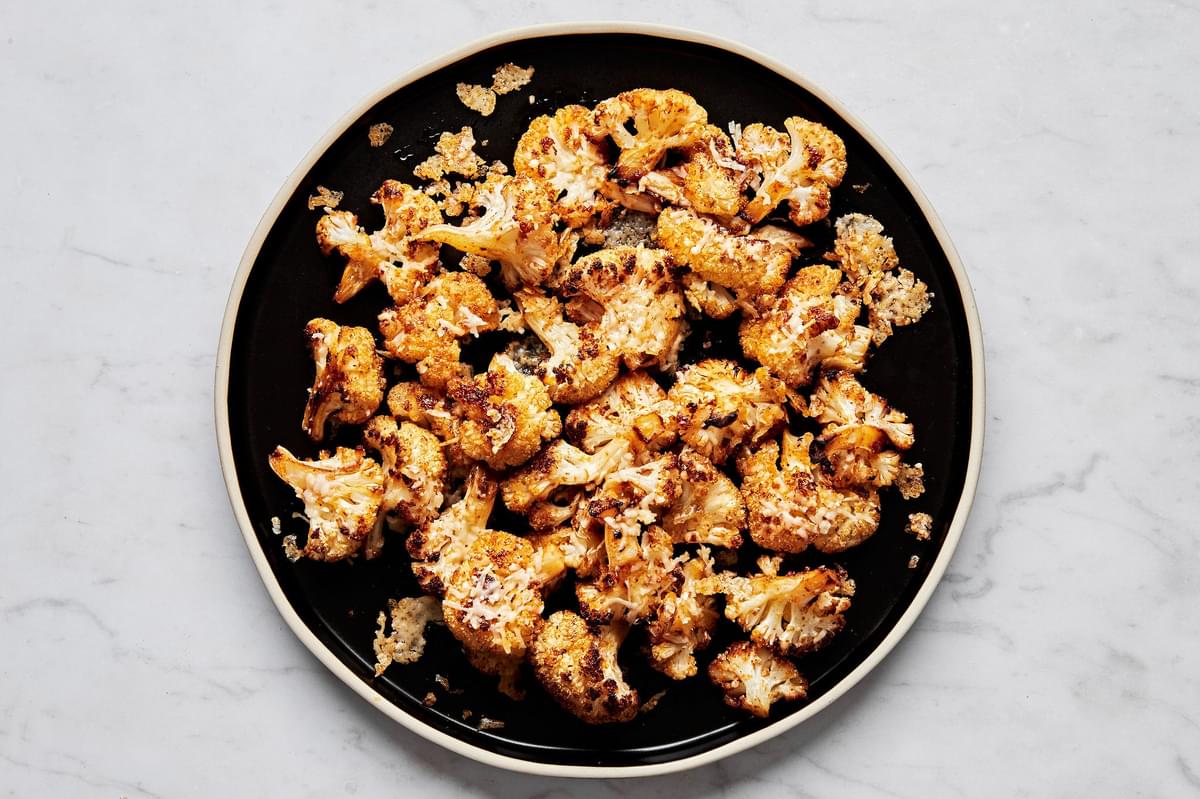 roasted cauliflower florets seasoned with  olive oil, salt, garlic powder, smoked paprika, red pepper flakes, and Parmesan