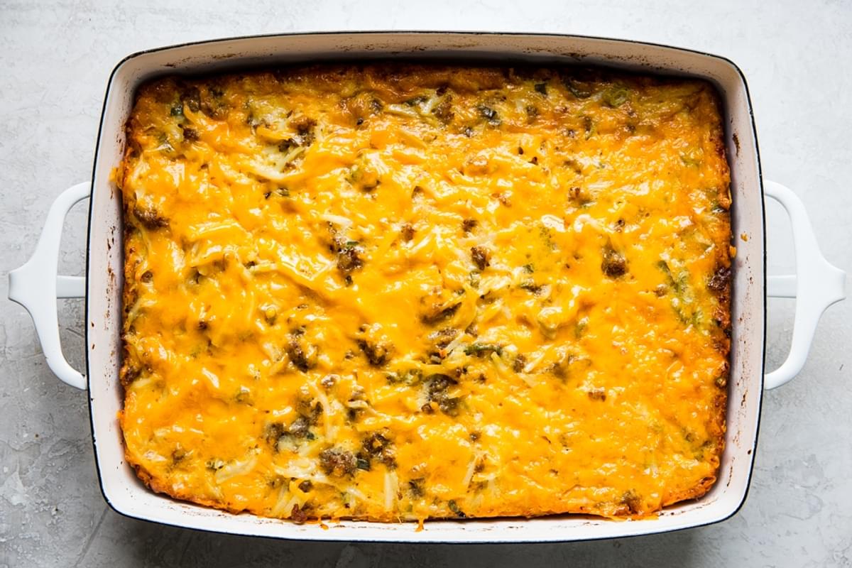 baked cheesy breakfast casserole with hash browns in a baking dish