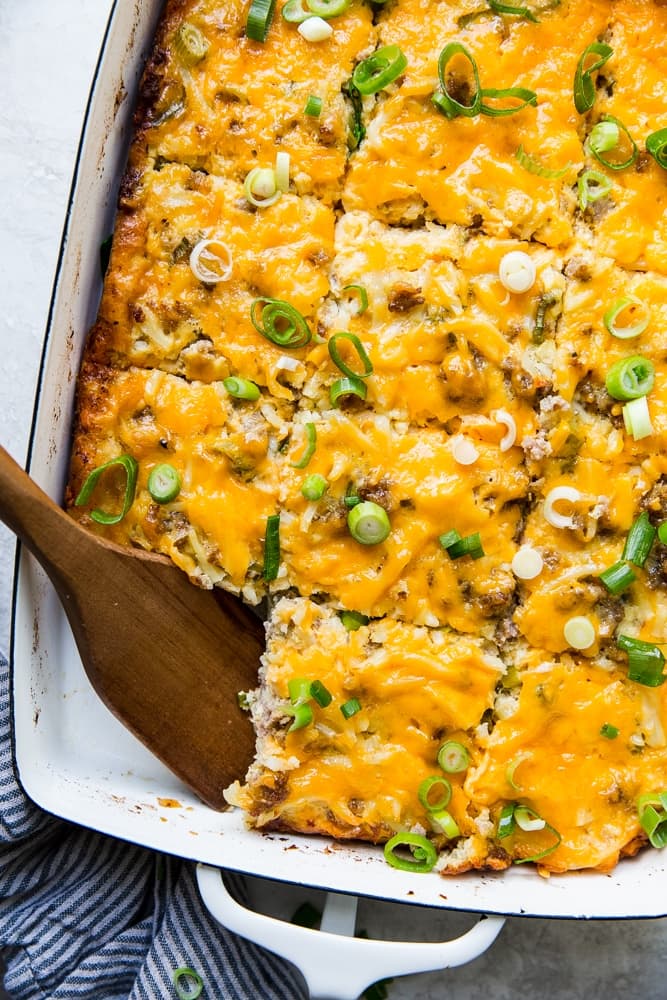 sausage breakfast casserole with hash browns in a baking dish