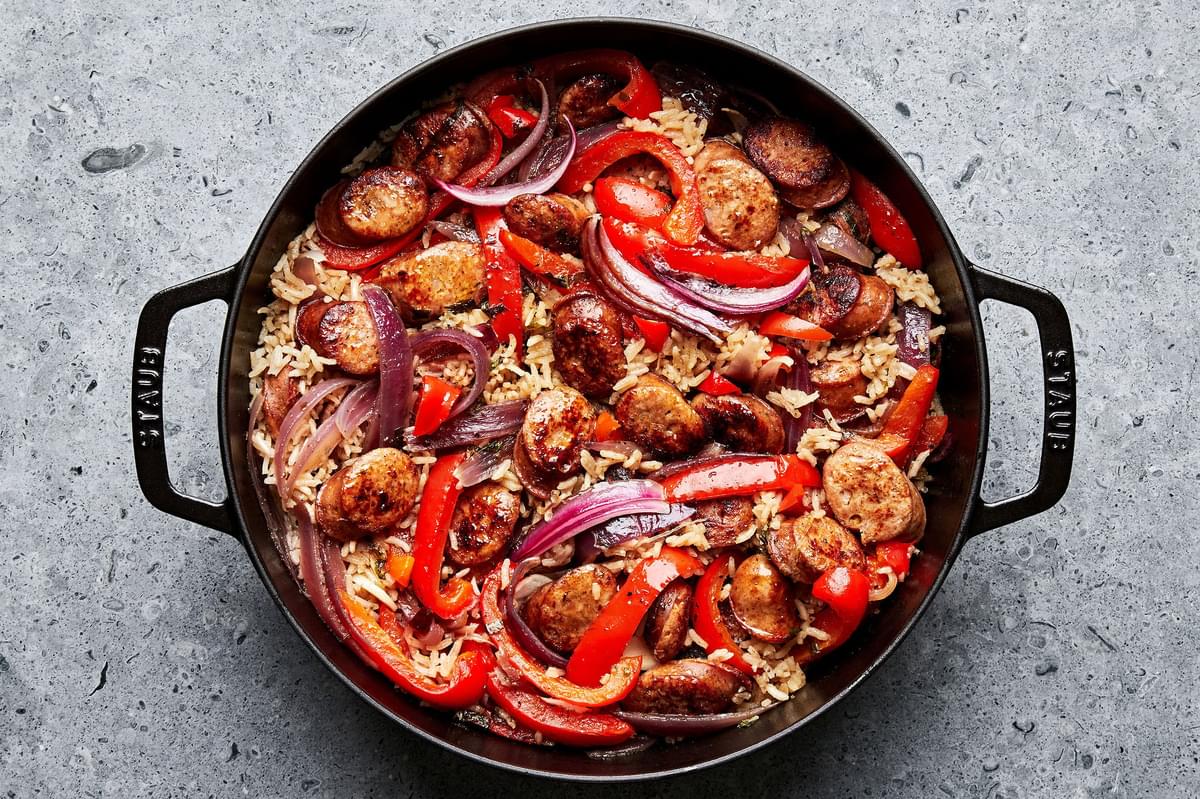 sausage and rice skillet made with italian chicken sausage, peppers, onions, spices, basil, rice and chicken stock