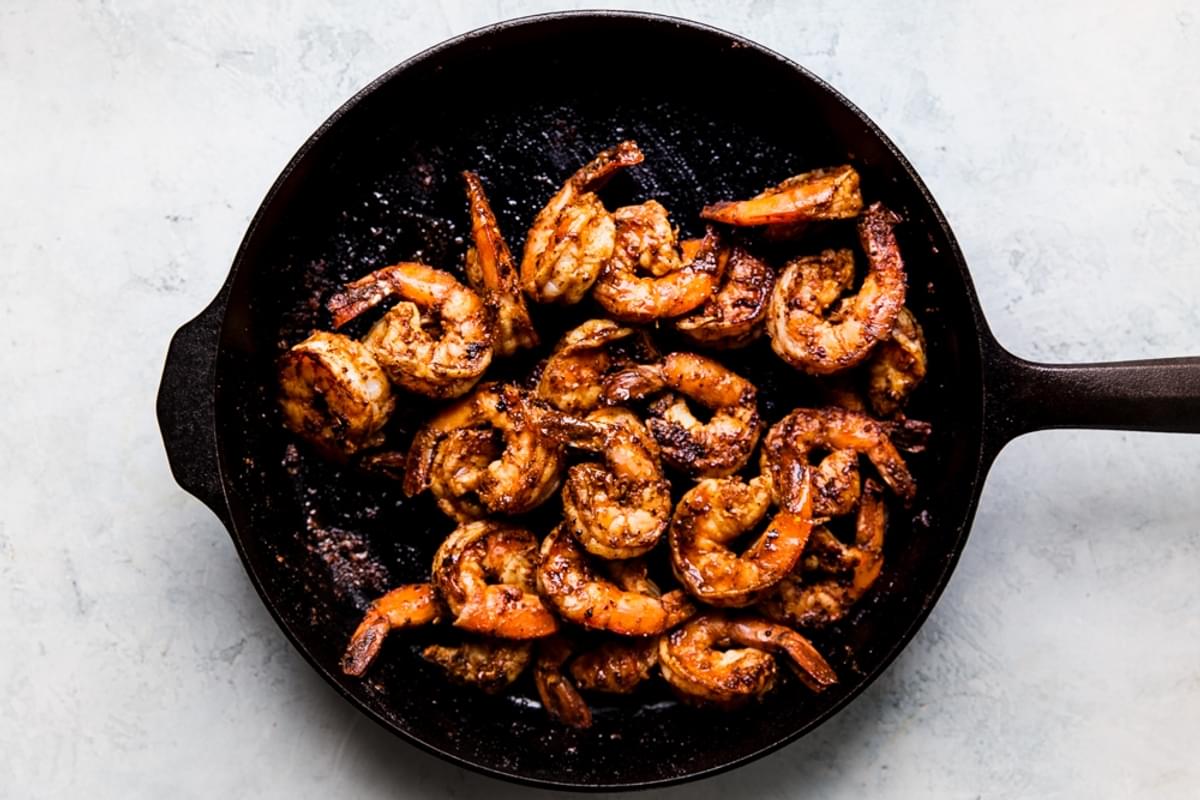 shrimp sautéed in a skillet with taco seasoning and olive oil
